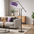 Nowoczesna lampa podłogowa z regulowanym ramieniem i stylowym, fioletowym abażurem to idealne oświetlenie do designerskiego salonu. Minimalistyczna forma, solidna konstrukcja i funkcjonalność sprawiają, że doskonale łączy estetykę z wygodą użytkowania.