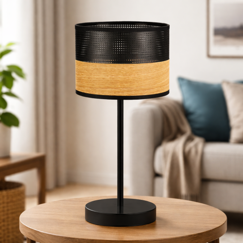 Nowoczesna lampka stołowa z cylindrycznym kloszem łączącym perforowany metal i naturalne drewno. Stylowy design idealny do salonu i sypialni. Zapewnia przytulne światło i elegancki akcent w każdym wnętrzu.