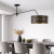 Nowoczesna lampa sufitowa z regulowanym ramieniem i eleganckim abażurem w czerni ze złotym marmurowym wzorem. Idealna do minimalistycznych wnętrz, jadalni i salonu. Designerskie oświetlenie łączące funkcjonalność z wyjątkowym stylem.